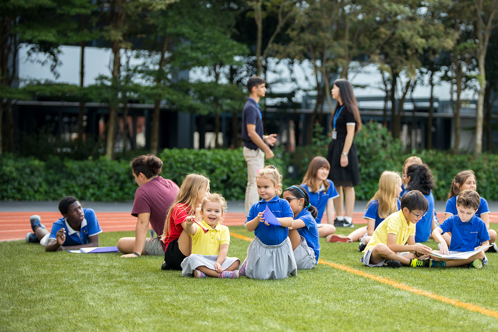 OFS Kindergarten, Elementary, Middle and High School students on the field