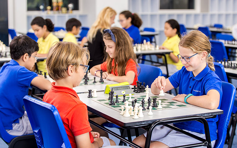 OFS Elementary School students playing chess against each other in the OFS Chess room